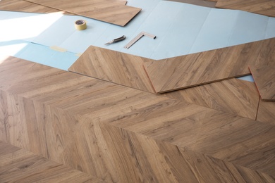 Photo of Installation of laminated wooden floor at home