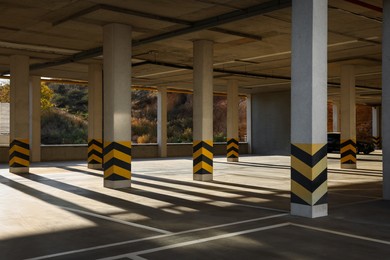 Photo of Empty open car parking garage on sunny day