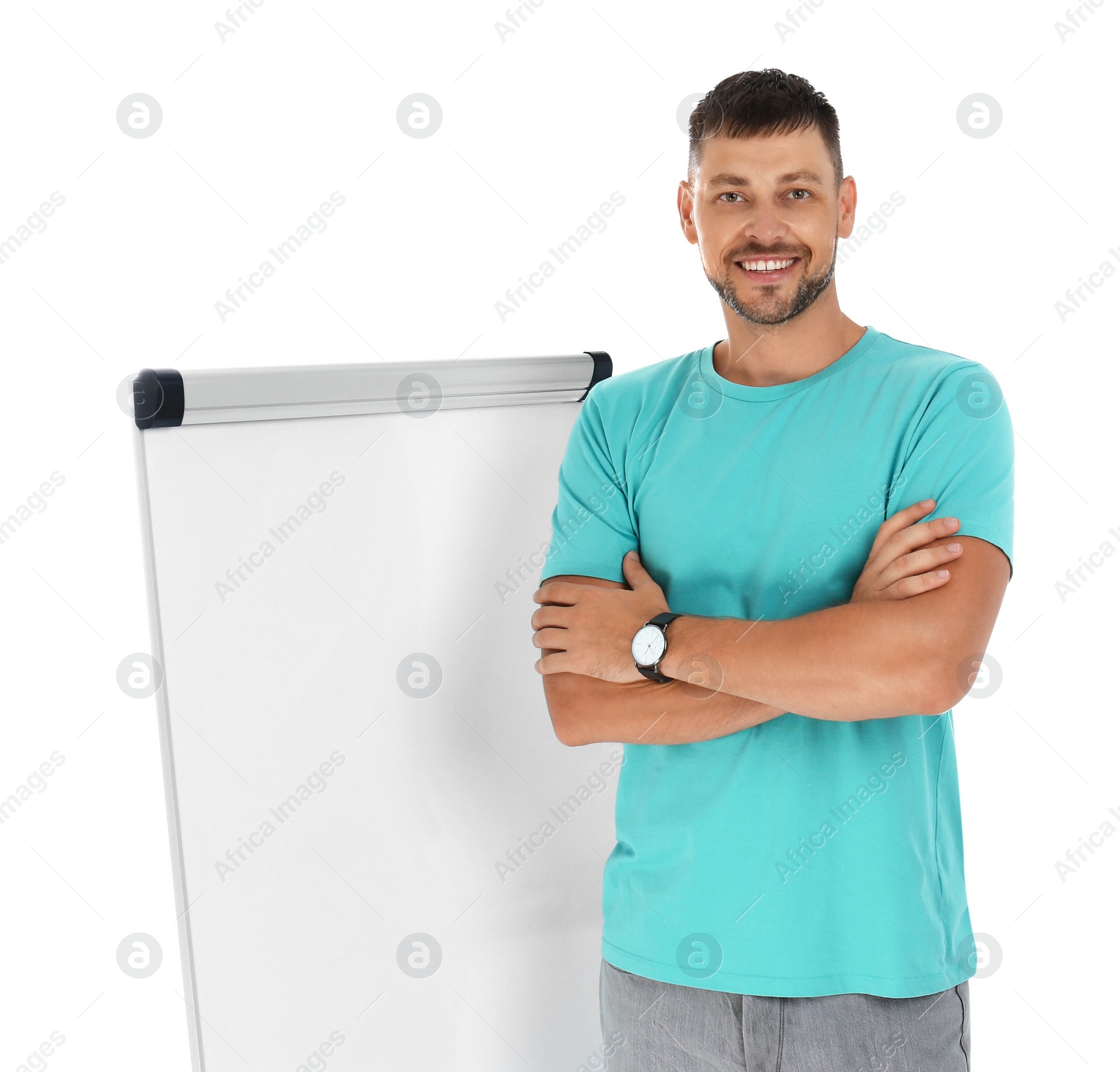 Photo of Professional business trainer near flip chart board on white background