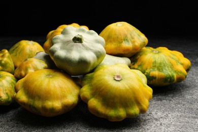 Photo of Fresh ripe pattypan squashes on grey table