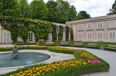 SALZBURG, AUSTRIA - JUNE 22, 2018: Mirabell garden with fountain and flowers