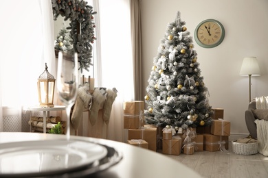 Photo of Stylish Christmas interior with beautiful decorated tree