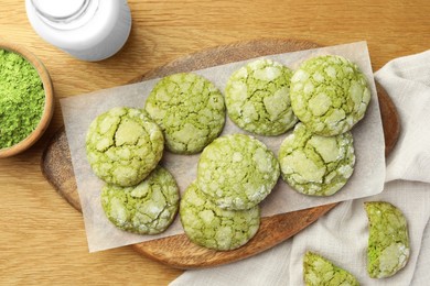 Photo of Tasty matcha cookies on wooden table, flat lay