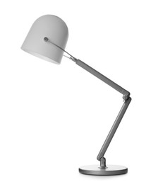 Photo of Stylish modern table lamp on white background