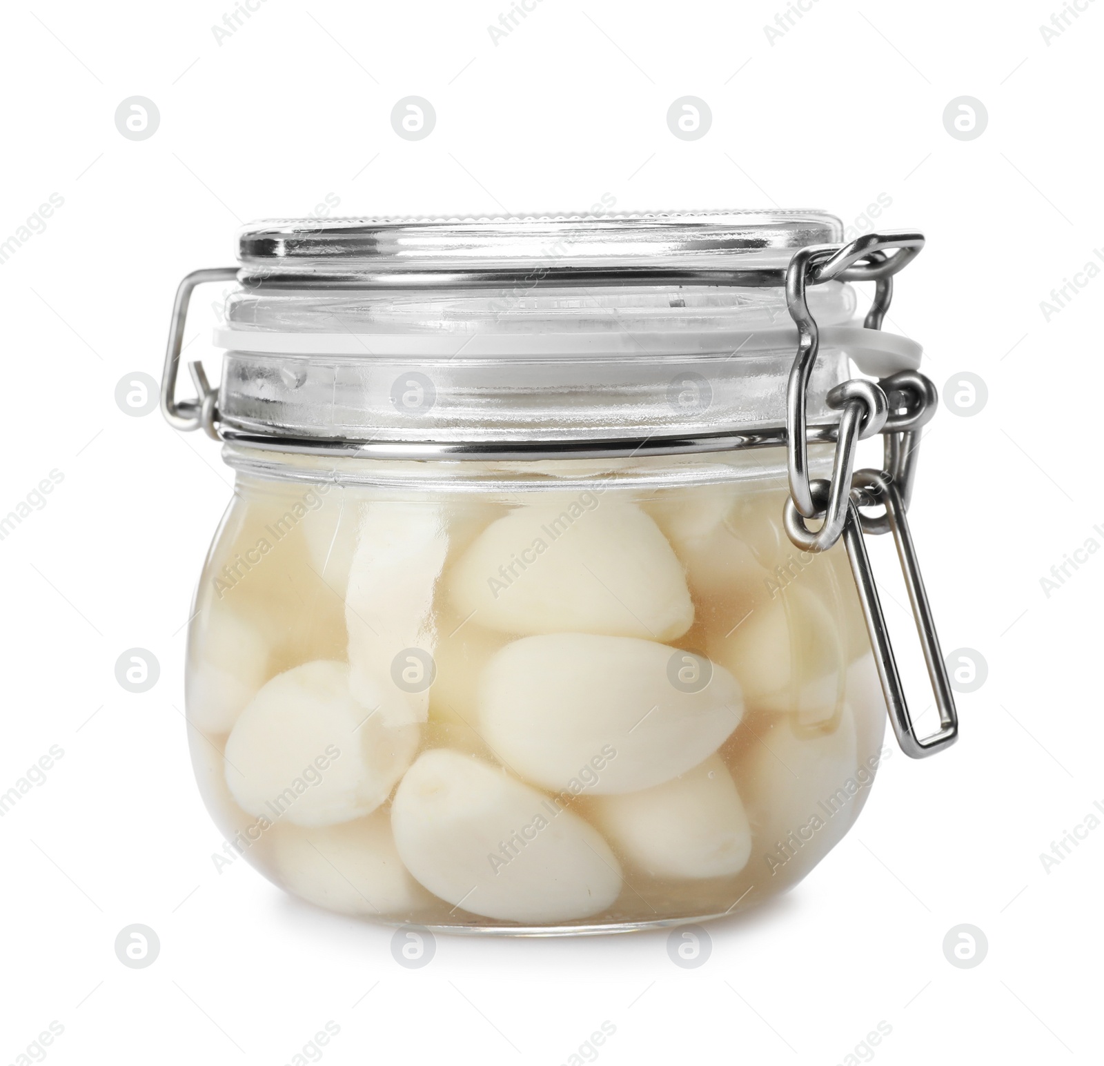 Photo of Glass jar with preserved garlic on white background