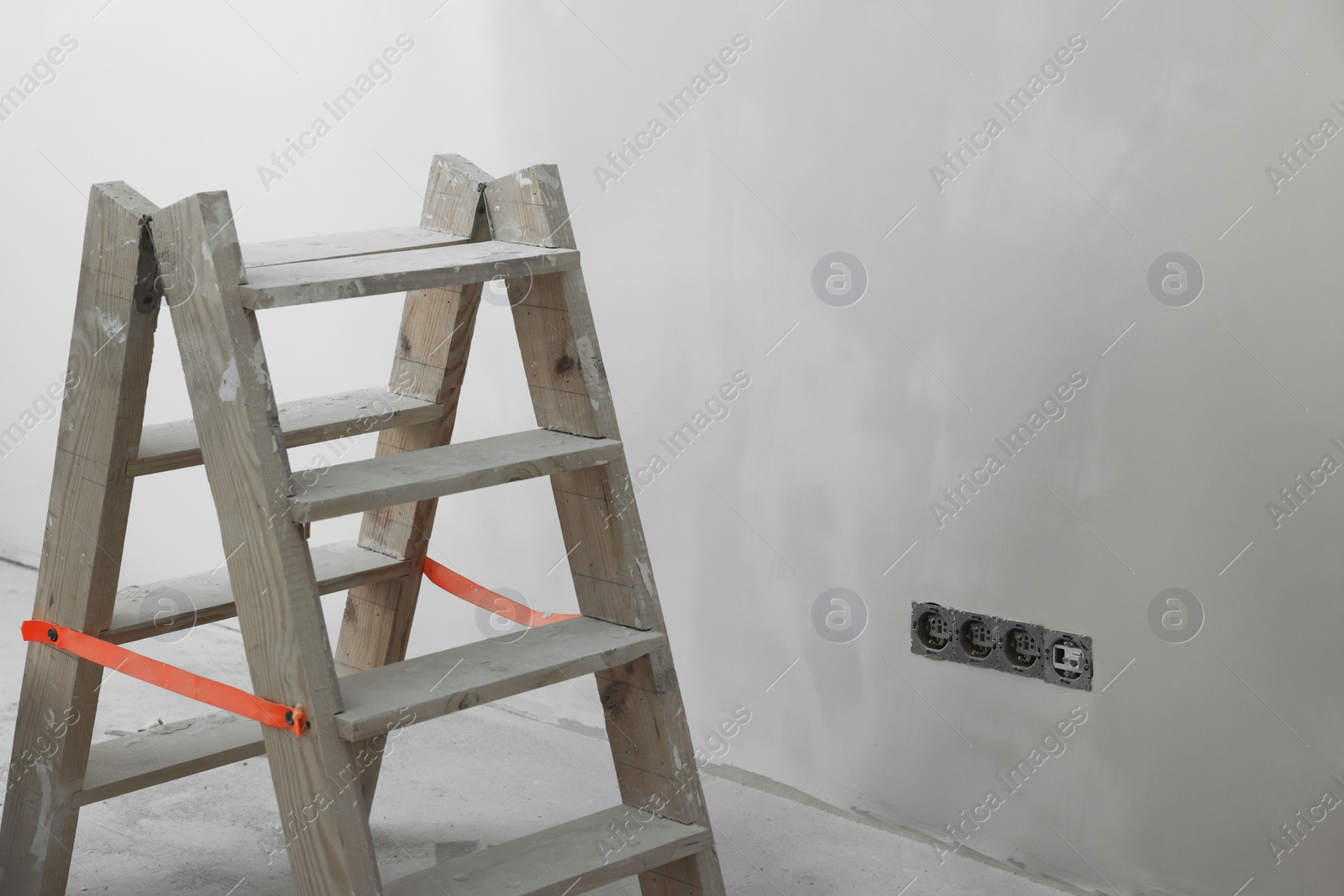 Photo of Wooden ladder near wall, space for text