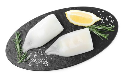 Photo of Fresh raw squid tubes with lemon, rosemary and salt on white background, top view
