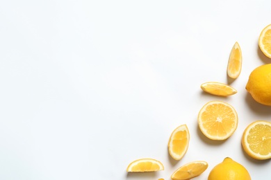 Photo of Fresh lemons on white background, top view. Citrus fruits