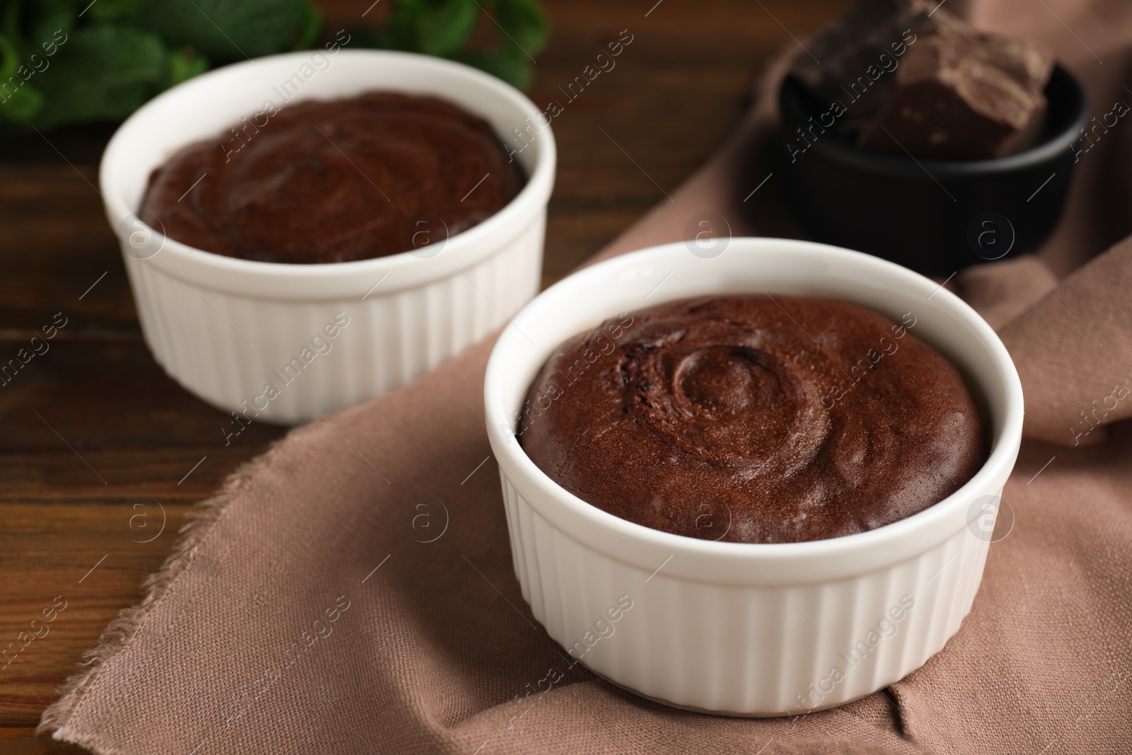 Photo of Delicious fresh chocolate fondant on wooden table, closeup