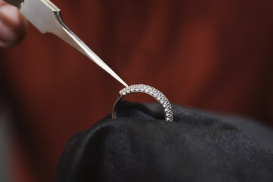 Beautiful ring with gemstones in jeweler's workshop, closeup