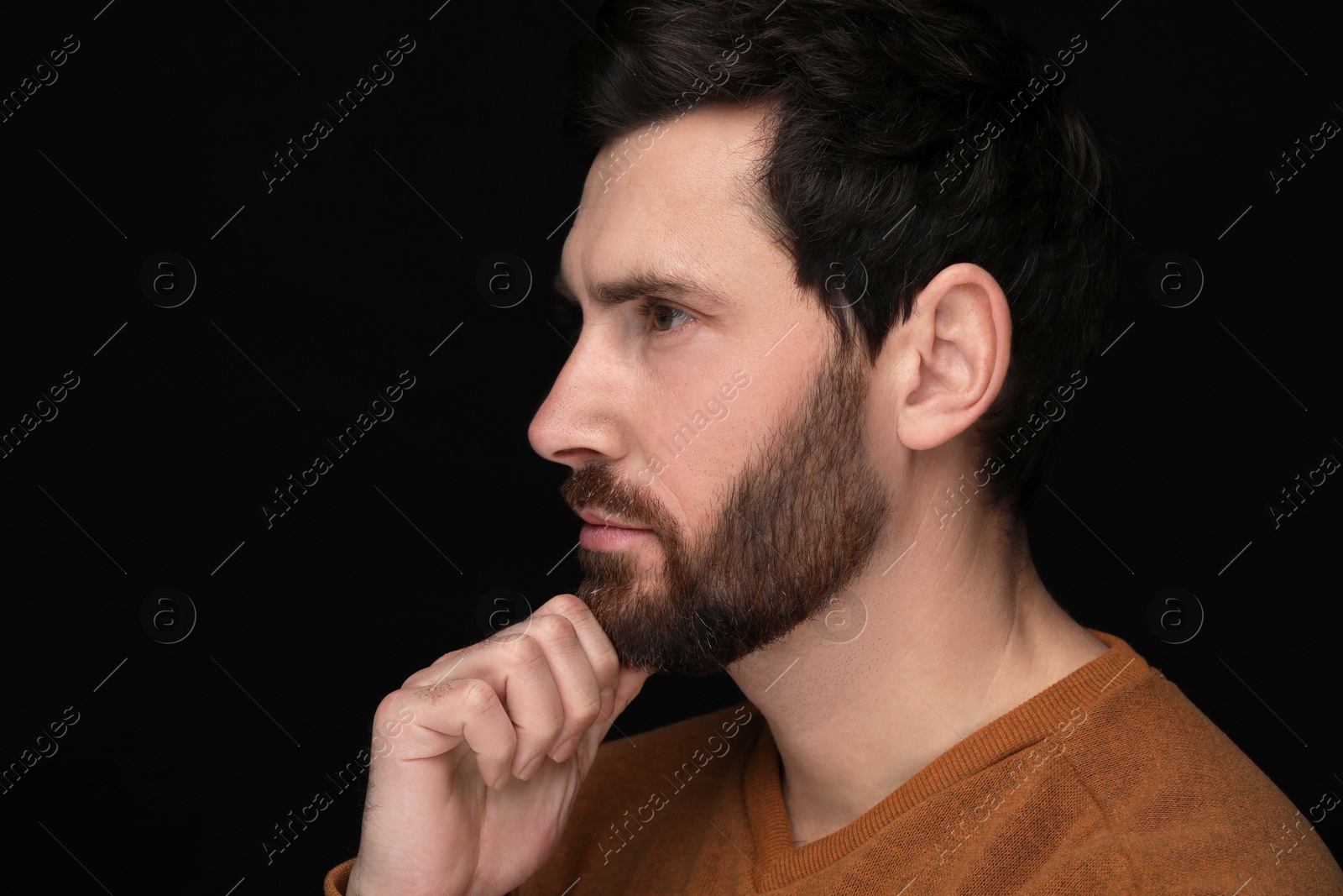 Photo of Evil eye. Man with scary eyes on black background