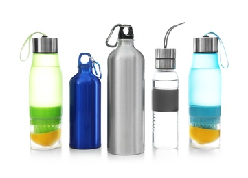 Photo of Different water bottles for sports on white background