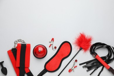 Photo of Sex toys and accessories on white background, flat lay. Space for text