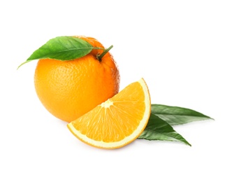 Photo of Cut and whole fresh ripe oranges with green leaves on white background