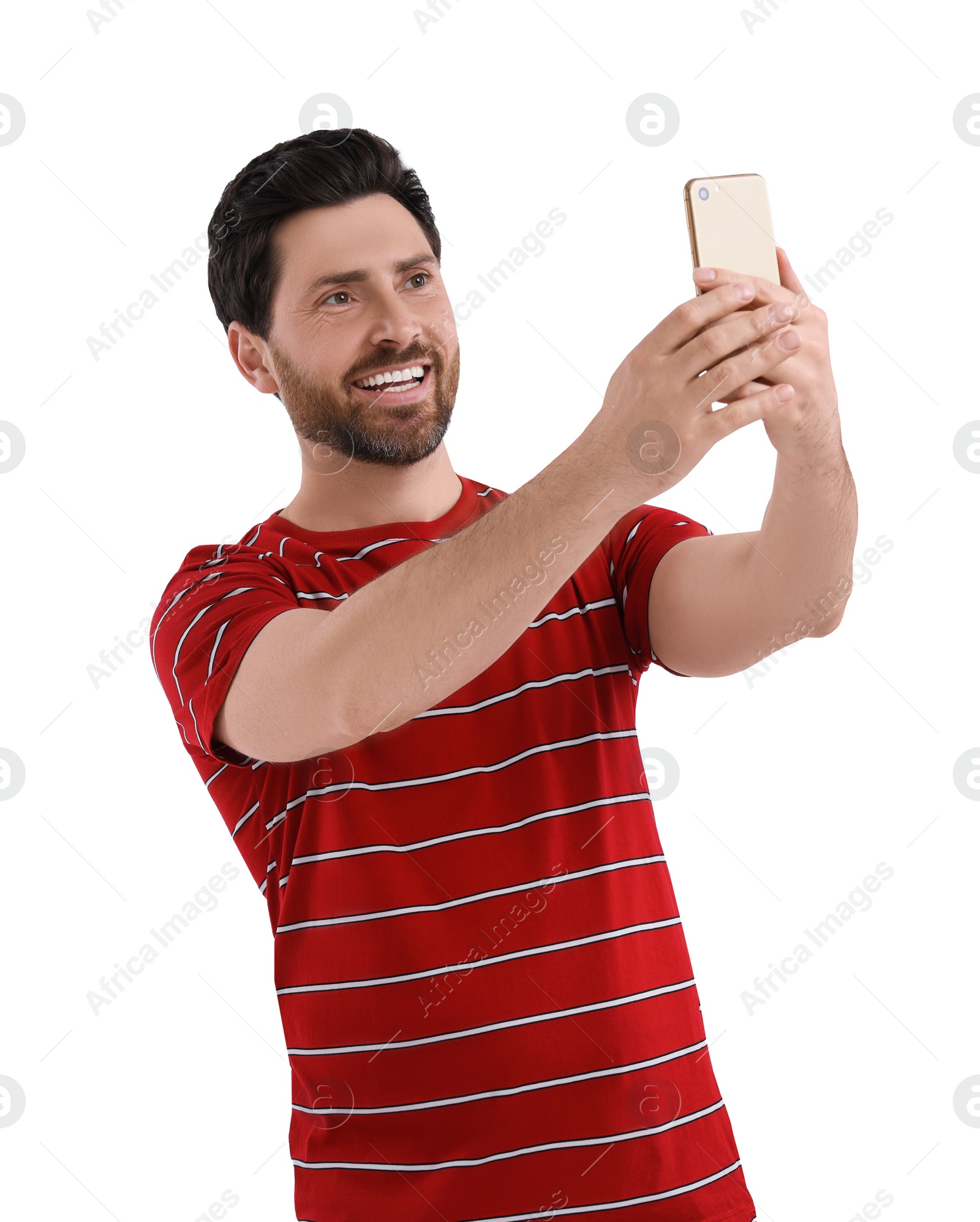 Photo of Smiling man taking selfie with smartphone on white background