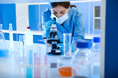 Scientist working with microscope indoors. Laboratory analysis