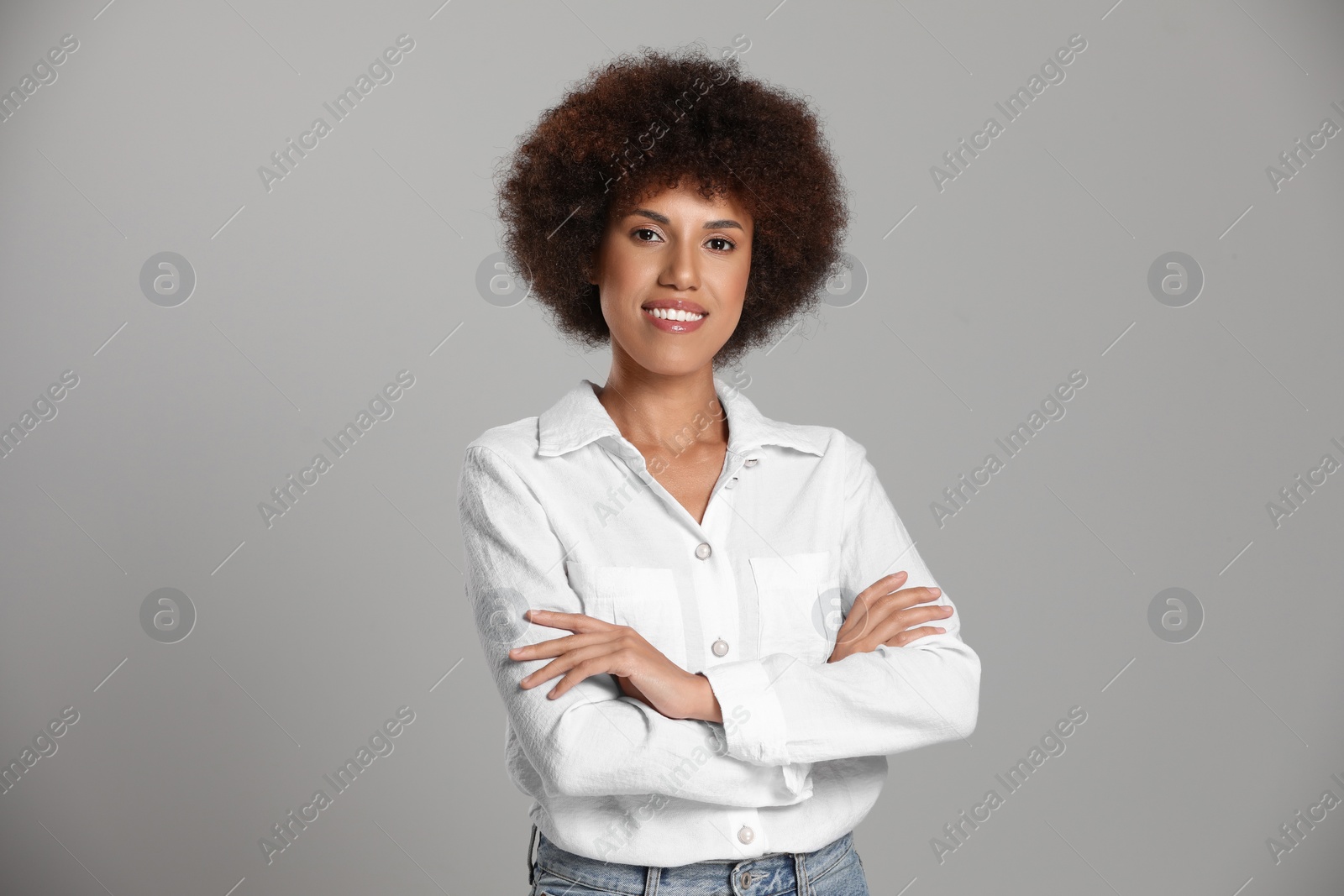 Photo of Portrait of beautiful young woman on grey background