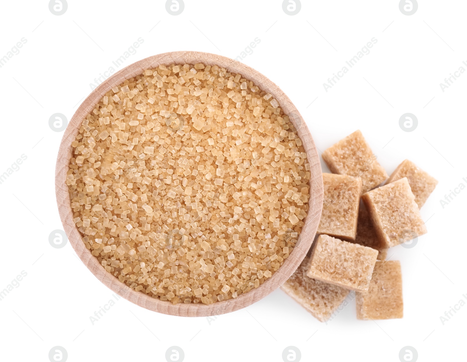 Photo of Different types of brown sugar and bowl isolated on white, top view