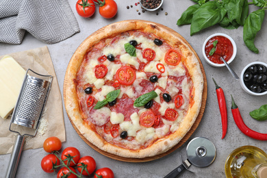 Photo of Delicious pizza Diablo on grey table, flat lay