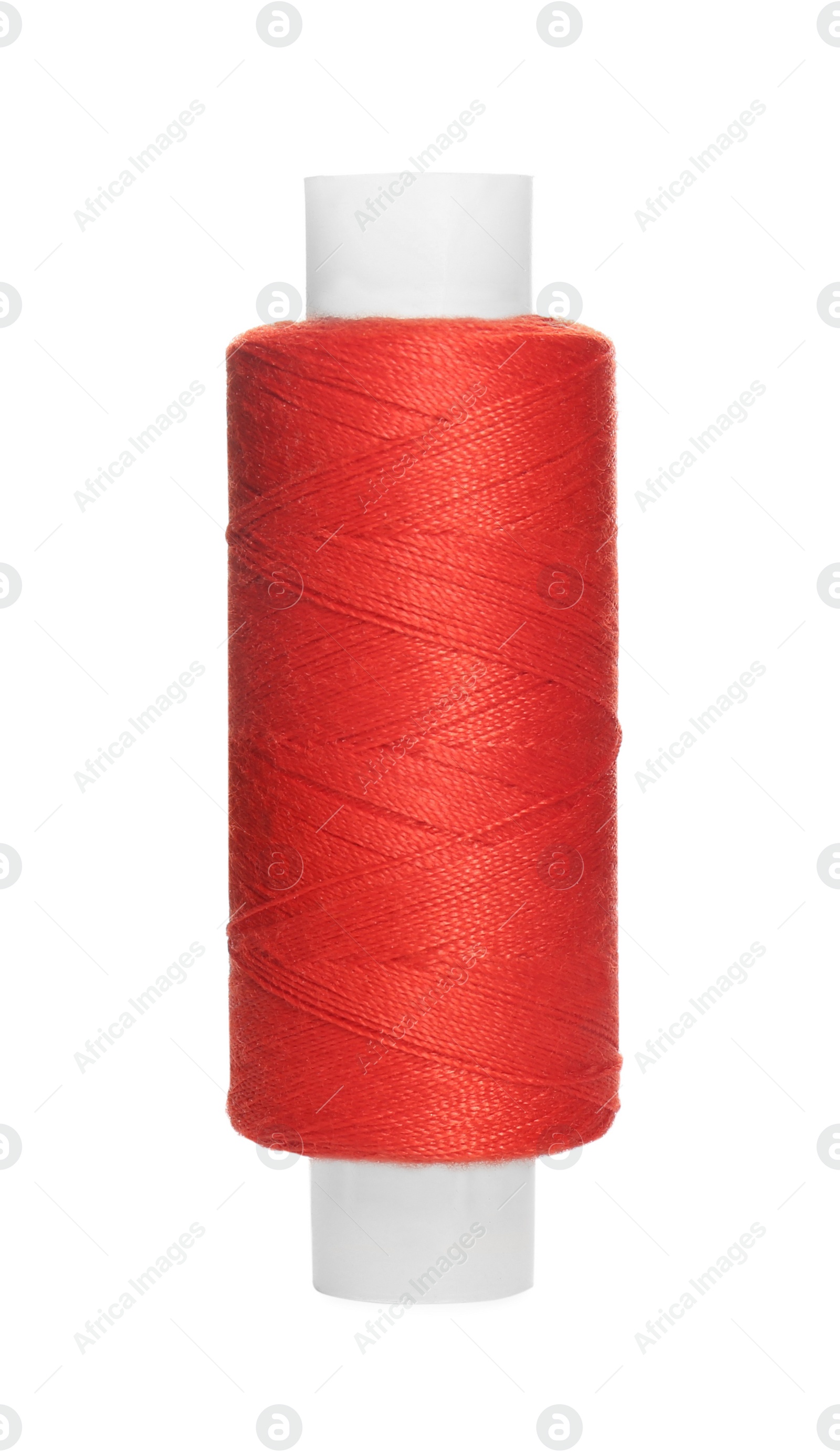 Photo of Spool of red sewing thread isolated on white