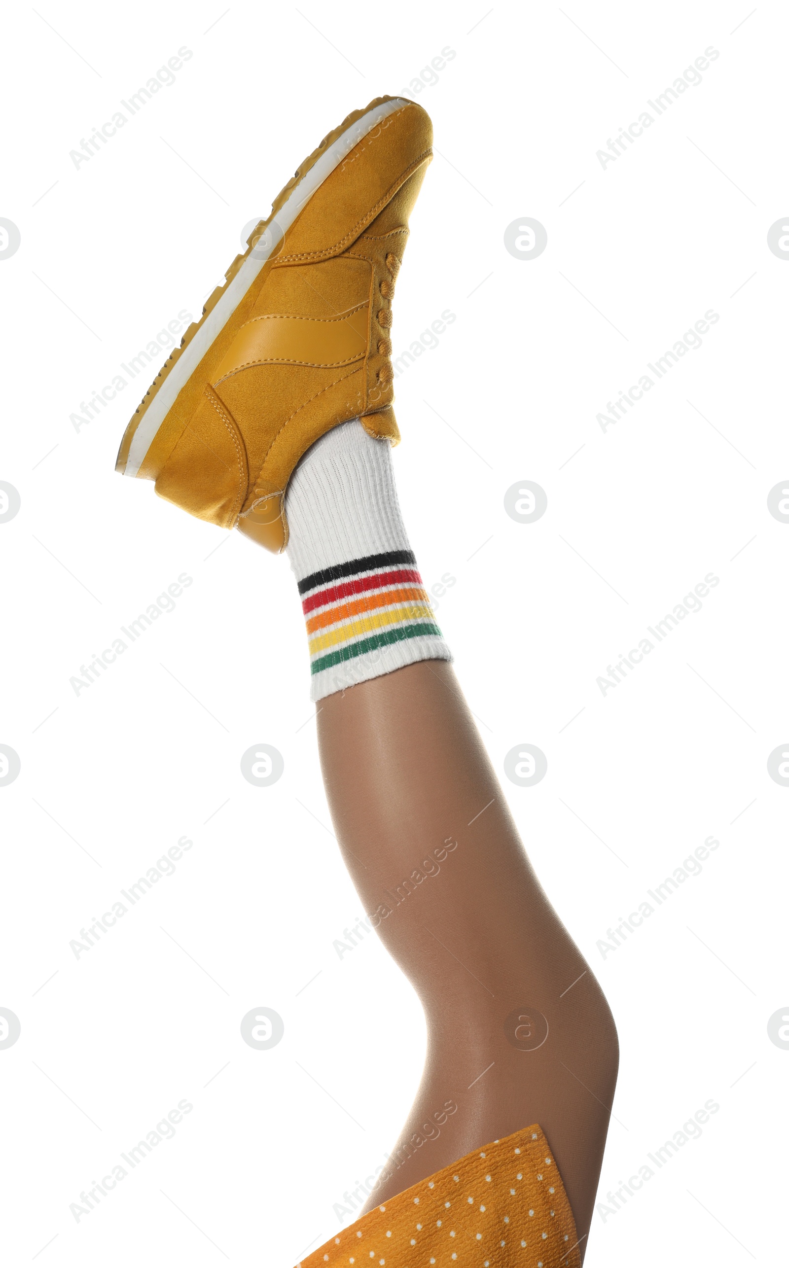 Photo of Woman wearing sneakers on white background, closeup