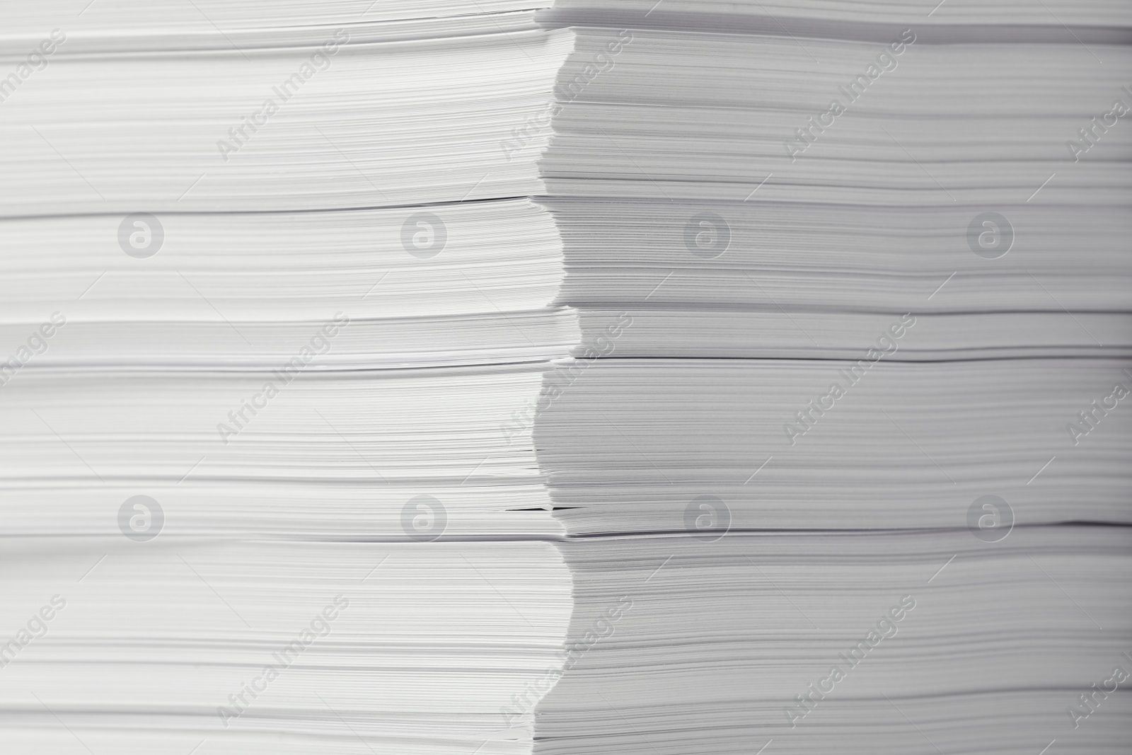 Photo of Stack of paper sheets as background, closeup