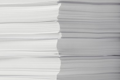 Photo of Stack of paper sheets as background, closeup