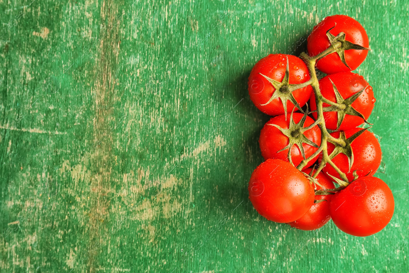 Photo of Fresh ripe tomatoes on wooden background, top view