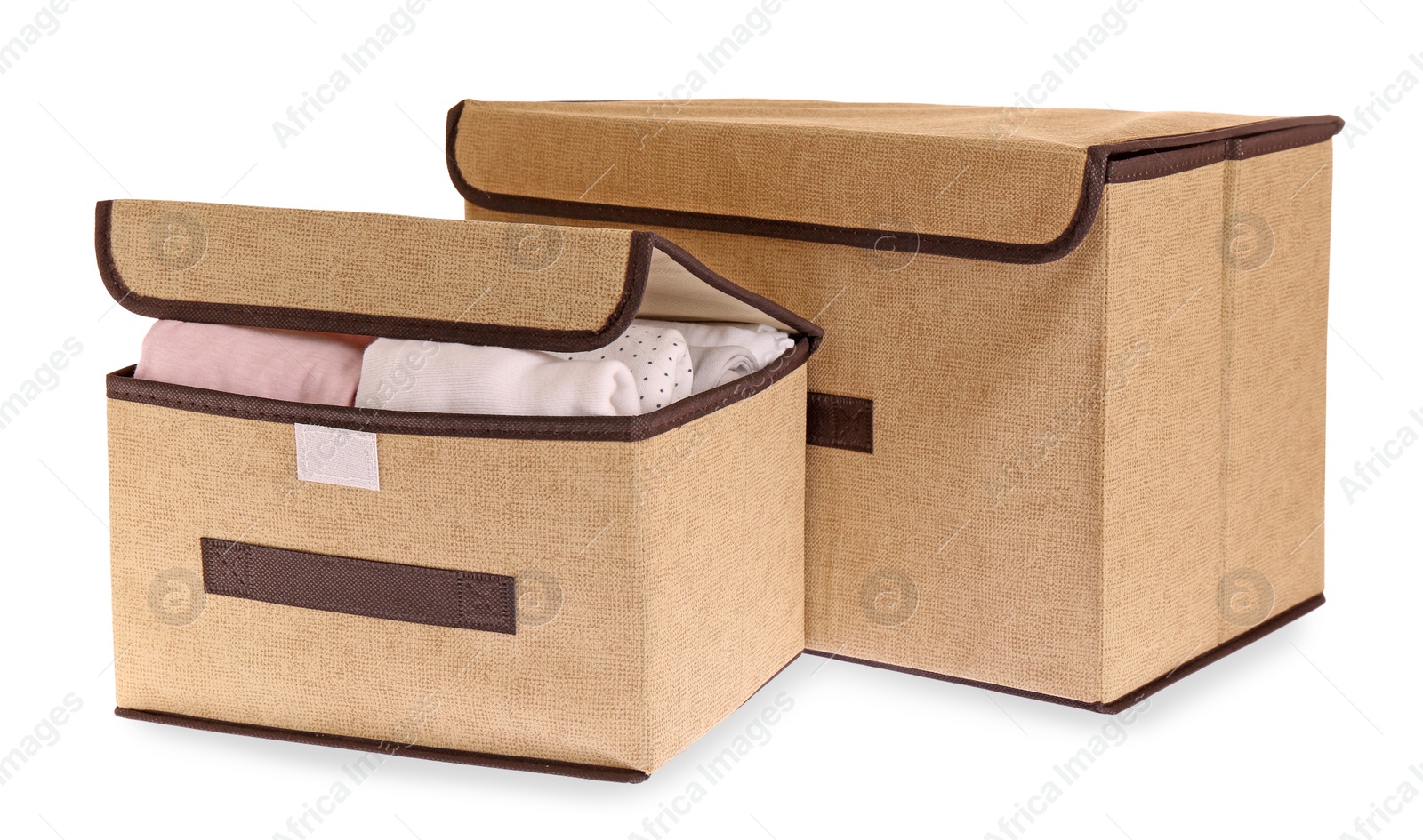 Photo of Textile storage cases with folded clothes on white background