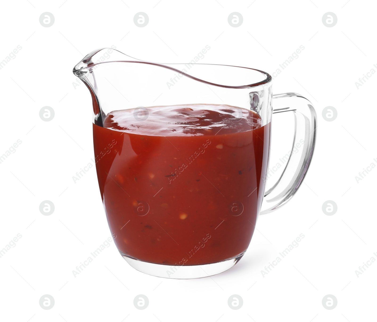 Photo of Glass jug with red sauce on white background