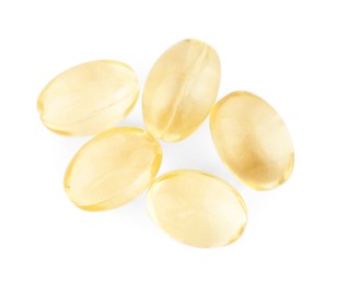 Photo of Vitamin capsules isolated on white, top view