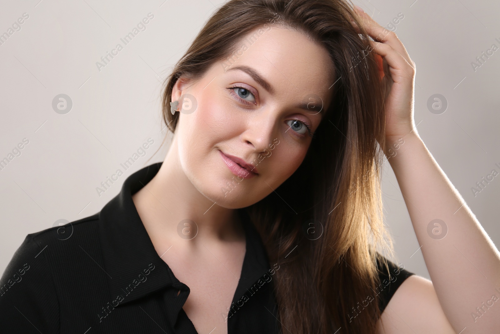 Photo of Portrait of beautiful young woman on beige background