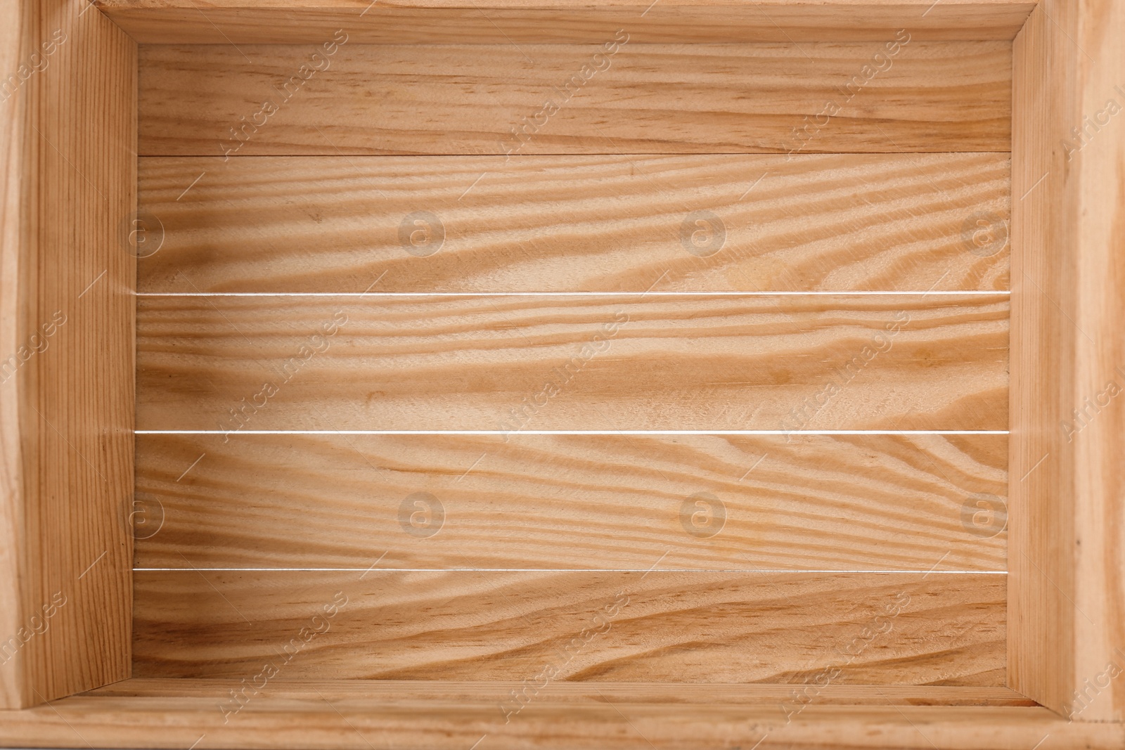 Photo of Top view of rustic wooden crate, closeup