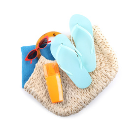 Photo of Bag with beach objects on white background, top view