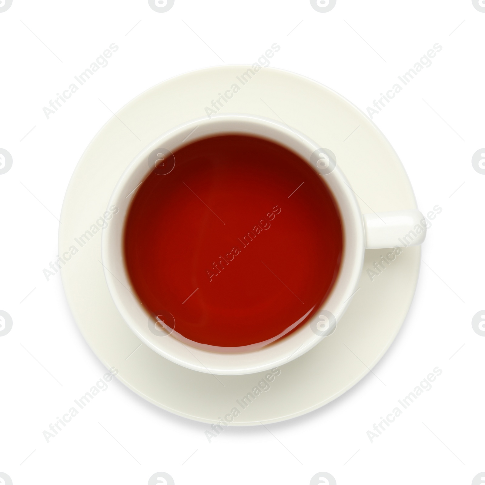 Photo of Cup of hot tea and saucer isolated on white, top view