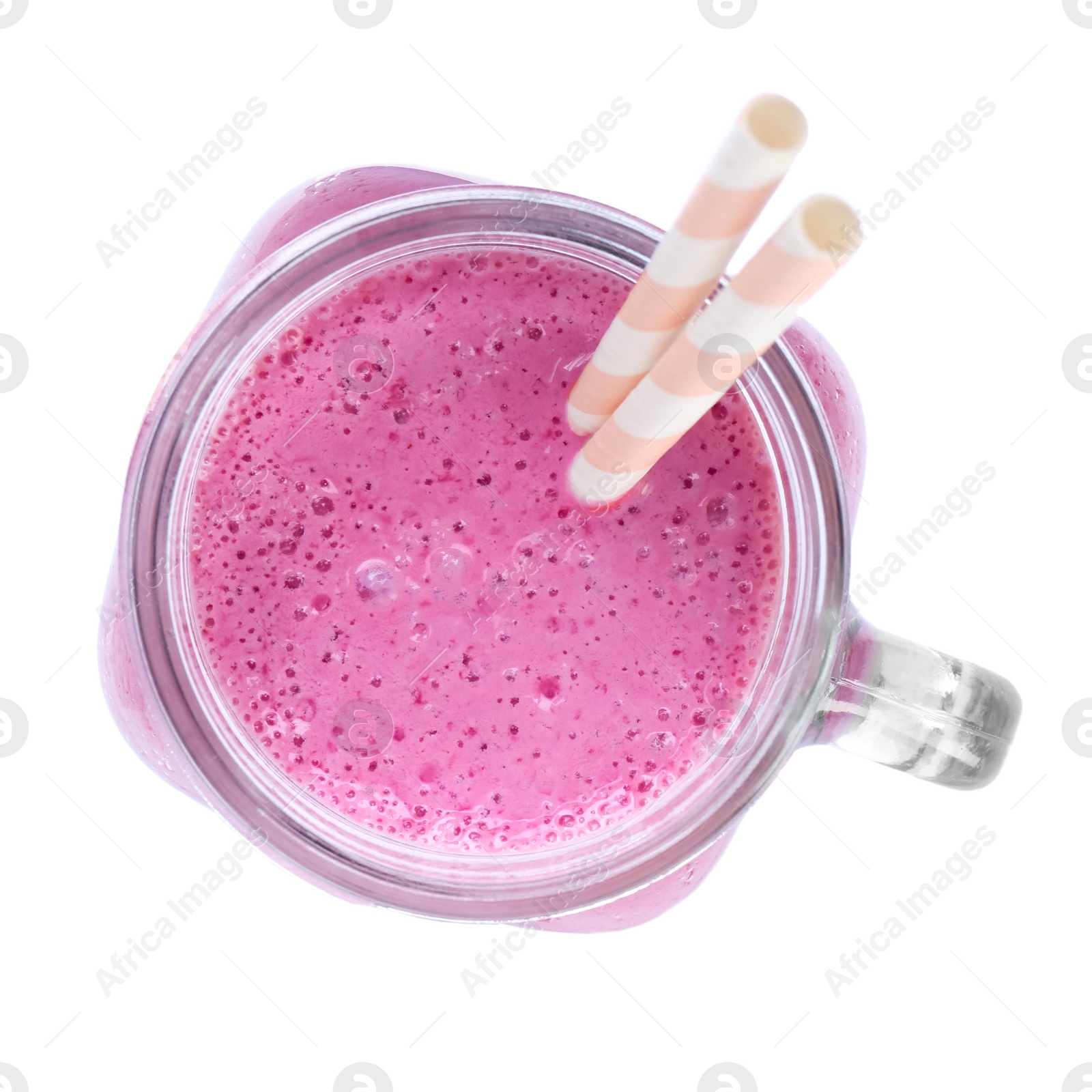 Photo of Mason jar of blackberry smoothie with straws isolated on white, top view