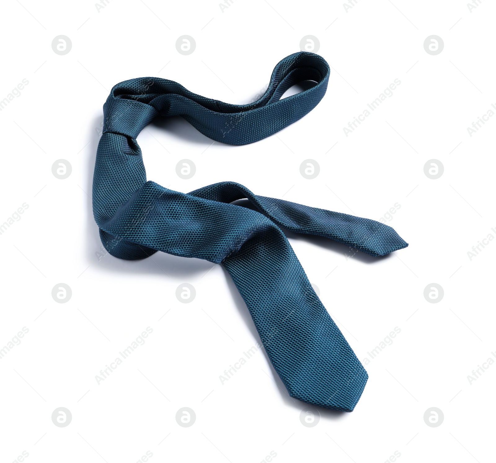 Photo of One blue necktie isolated on white, top view