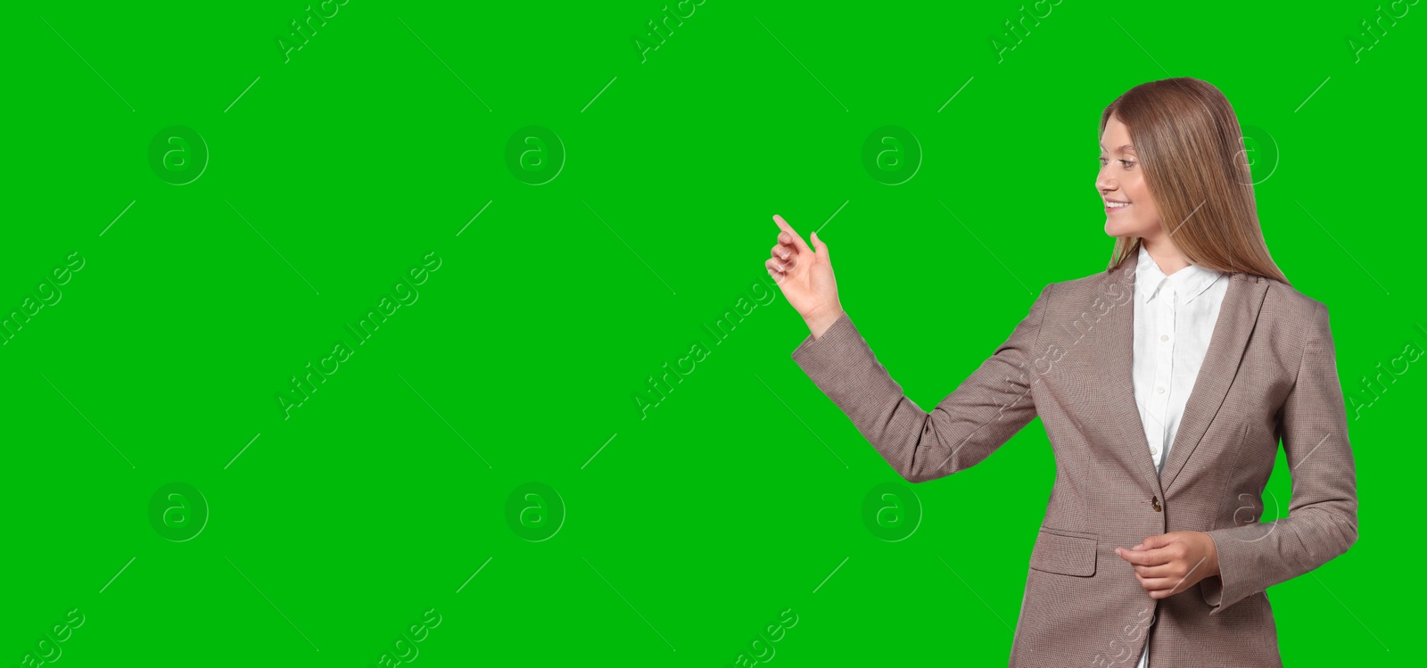 Image of Chroma key compositing. Broadcaster against green screen, banner design