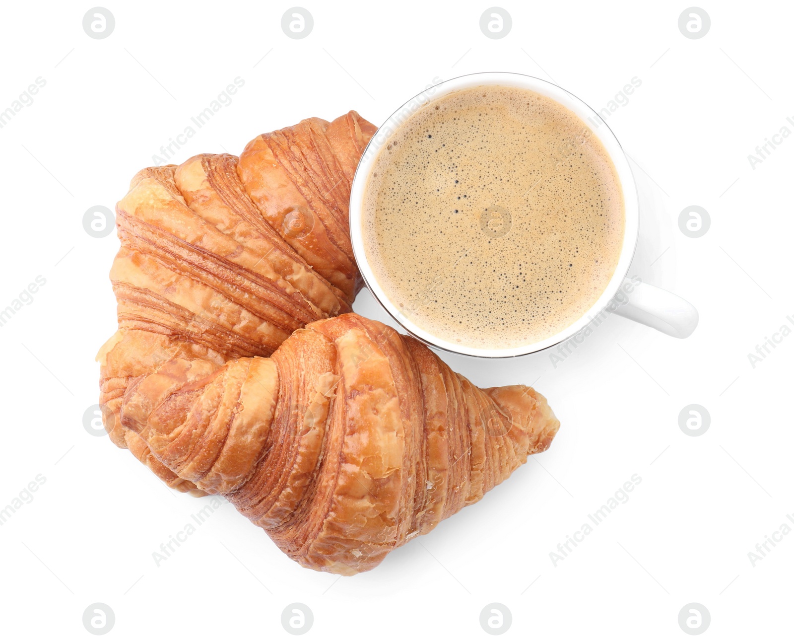 Photo of Fresh croissants and coffee isolated on white, top view. Tasty breakfast