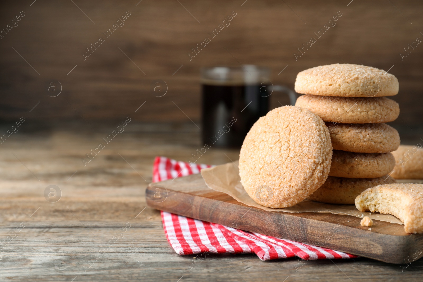 Photo of Delicious sugar cookies on wooden table, space for text