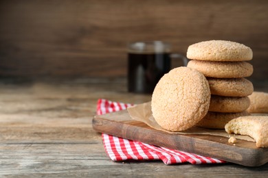 Delicious sugar cookies on wooden table, space for text