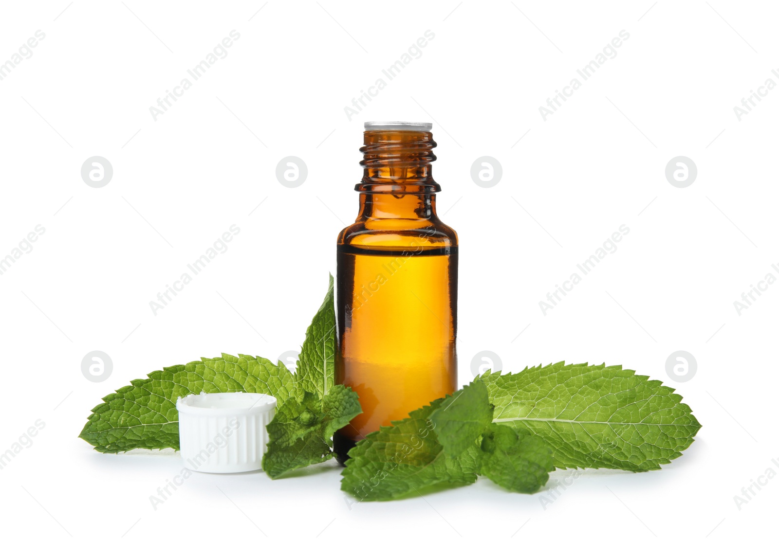 Photo of Bottle of essential oil and mint on white background