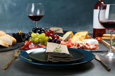 Photo of Wine and snacks served for dinner on table in restaurant