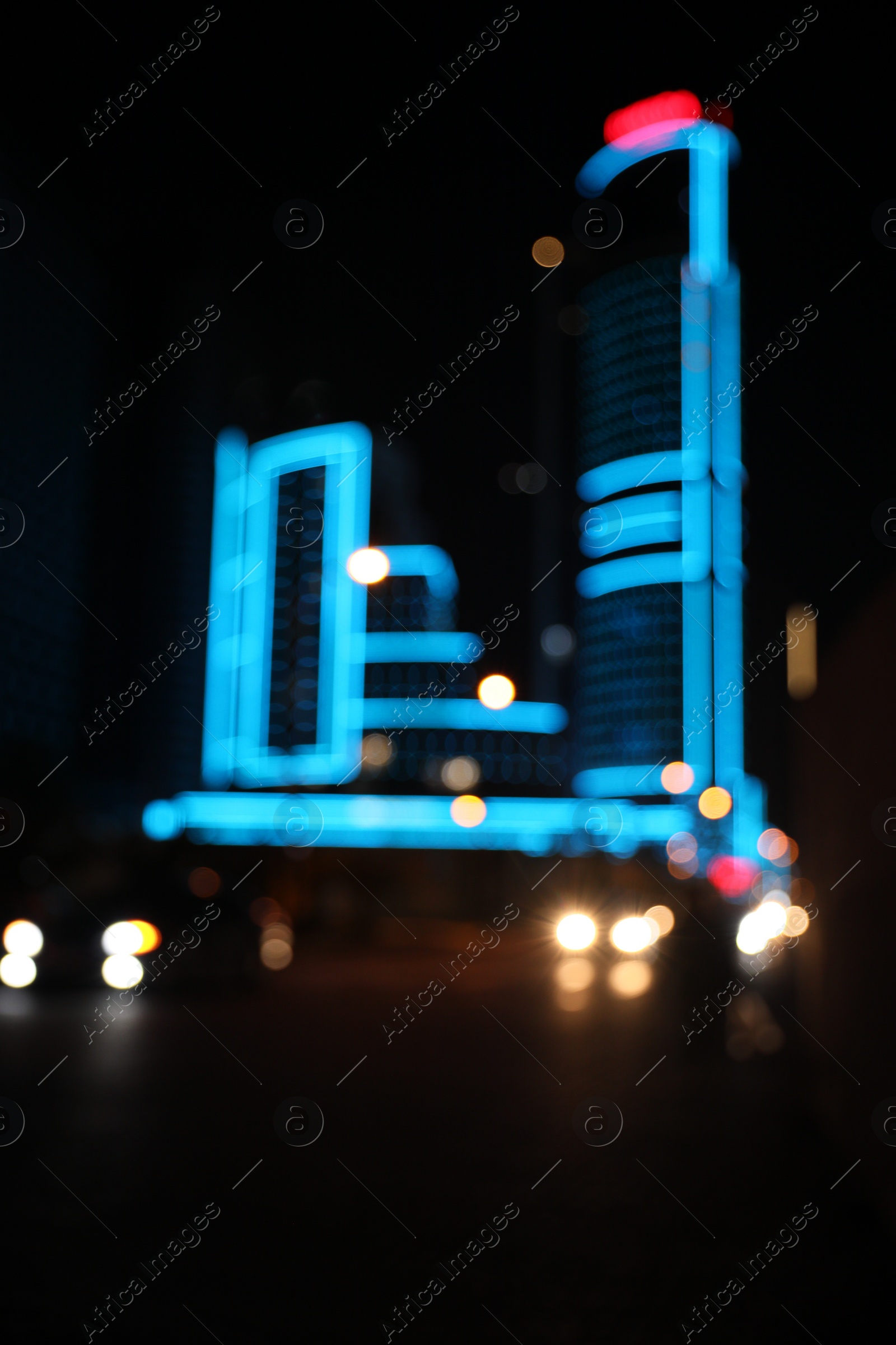 Photo of Blurred view of cityscape with bokeh effect. Night life