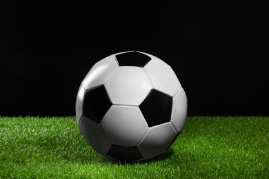 Photo of One soccer ball on green grass. Sports equipment