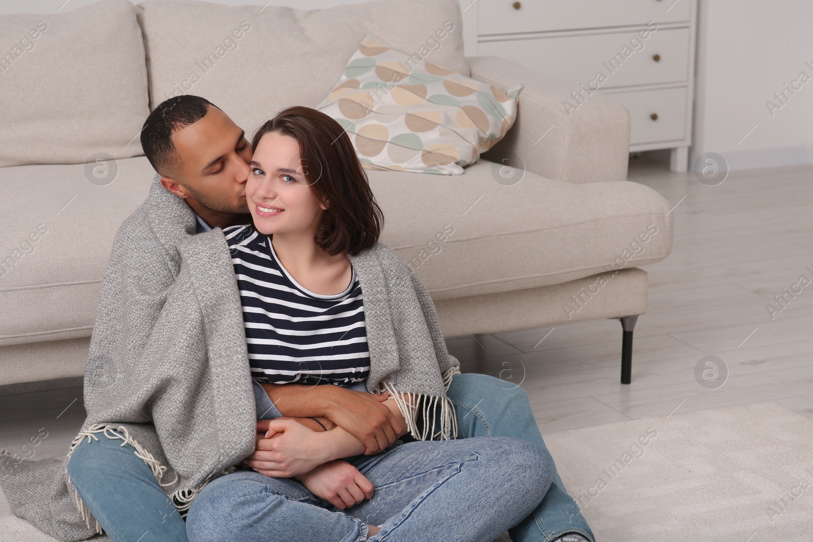 Photo of Dating agency. Man kissing his girlfriend indoors, space for text