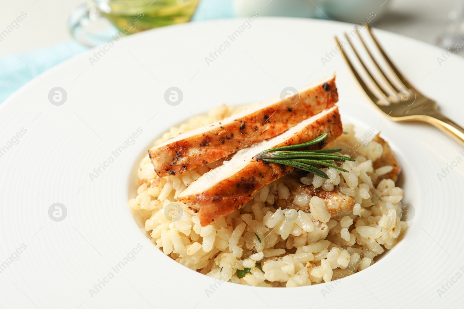 Photo of Delicious fresh chicken risotto in plate, closeup