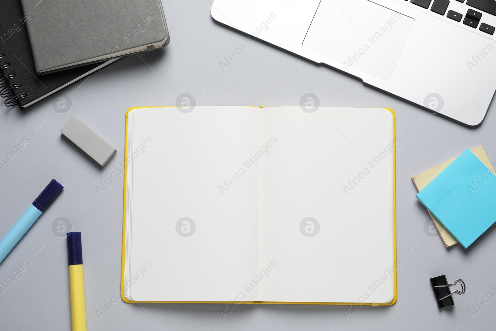 Photo of Flat lay composition with stylish notebooks on light grey table