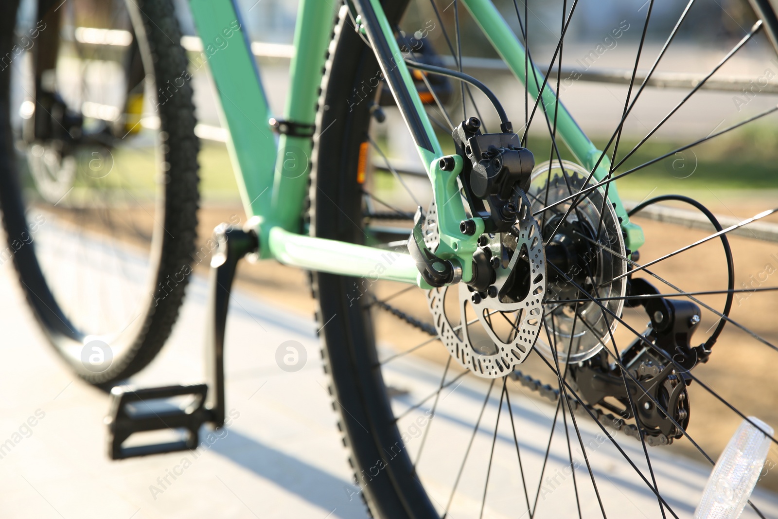 Photo of Modern green bicycle on city street, closeup