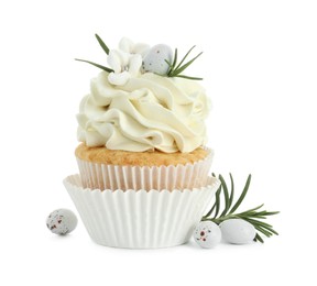 Tasty Easter cupcake with vanilla cream, candies and rosemary isolated on white